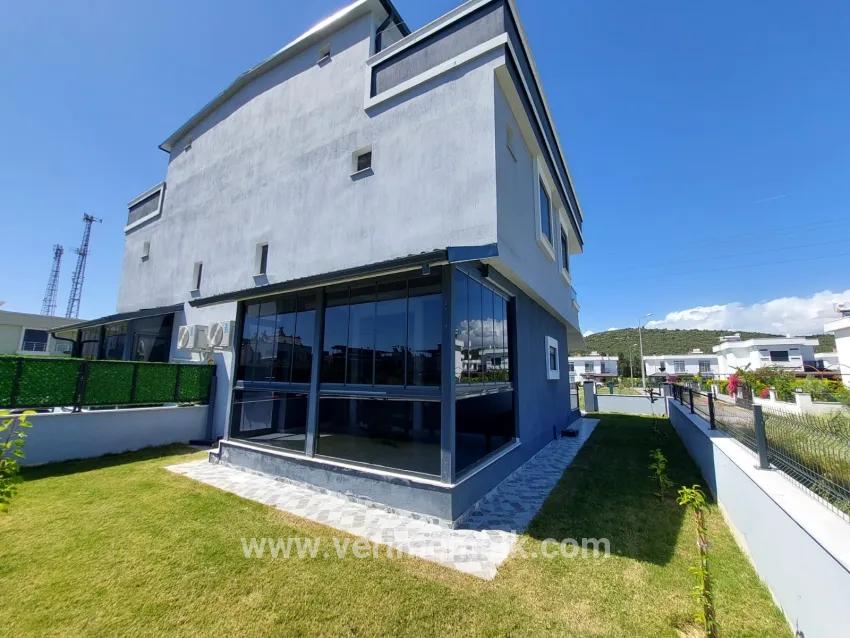 In the Republic Neighbourhood of Seferihisar, 1 km to the sea, a 4+1 wide garden luxurious villa for sale