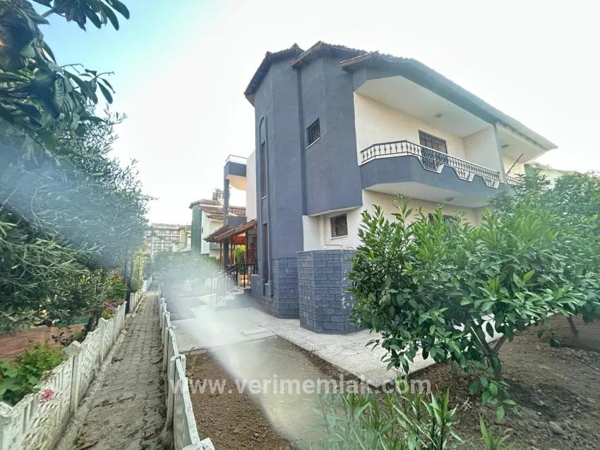 In Gümüldür, a 4+1 villa for sale with a large garden within a 100m site from the sea