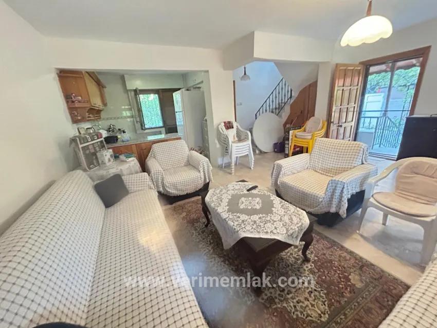 In Gümüldür, a 4+1 villa for sale with a large garden within a 100m site from the sea