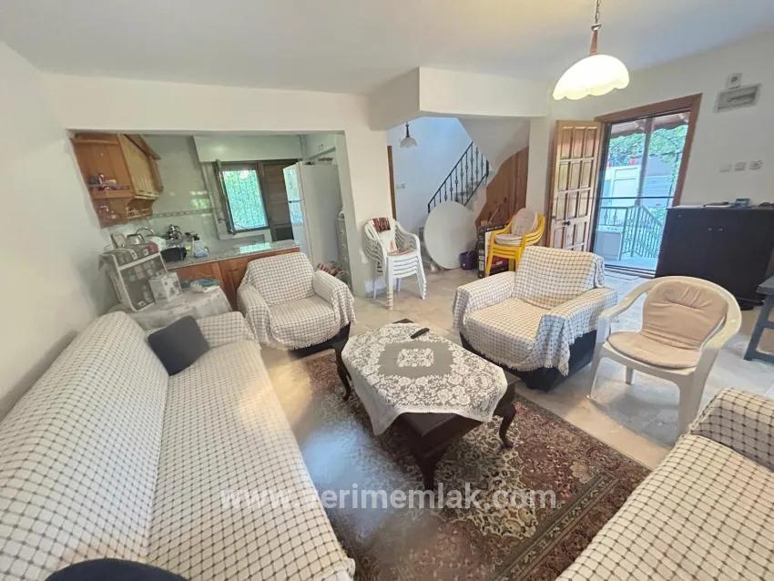 In Gümüldür, a 4+1 villa for sale with a large garden within a 100m site from the sea