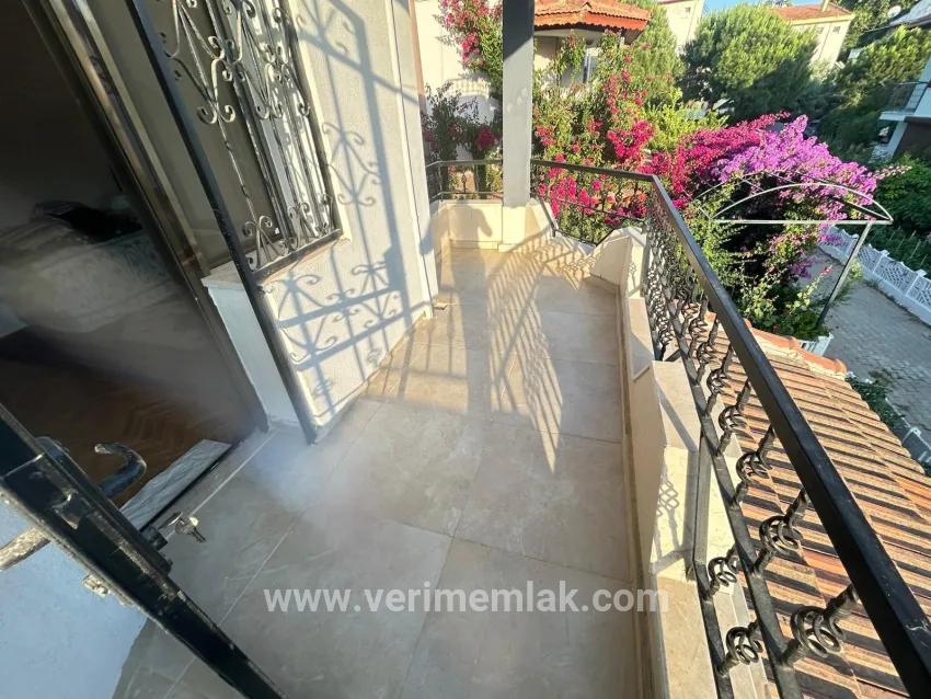 In Gümüldür, a 4+1 villa for sale with a large garden within a 100m site from the sea