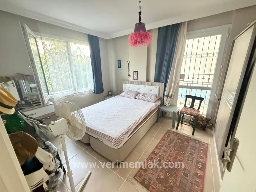 In Seferihisar Bengiler, 350m to the sea, a 2+1 apartment for sale with a wide garden with fruit trees!