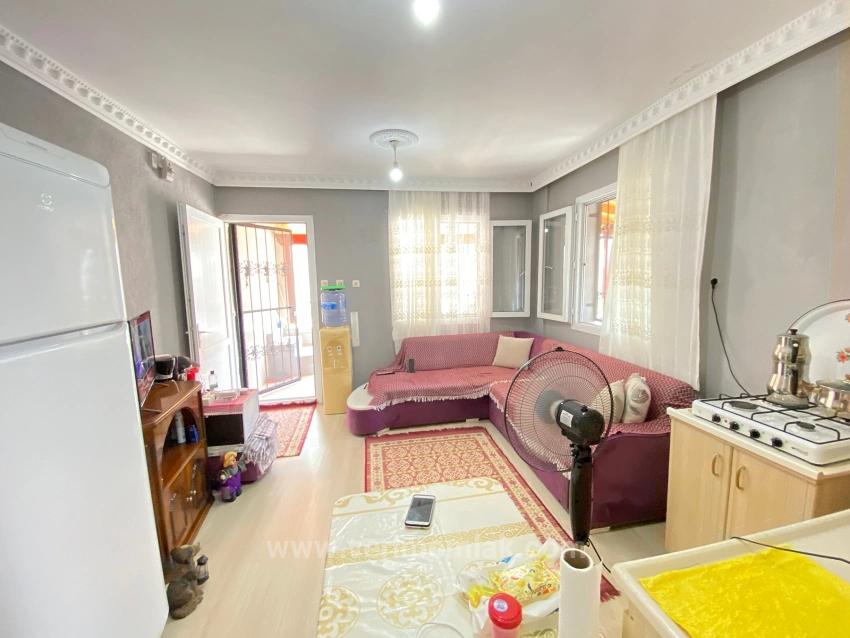 1+1 Ground Floor Apartment For Sale In Seferihisar Mersin Area, 100M From The Sea, With Garden And Renovation Required