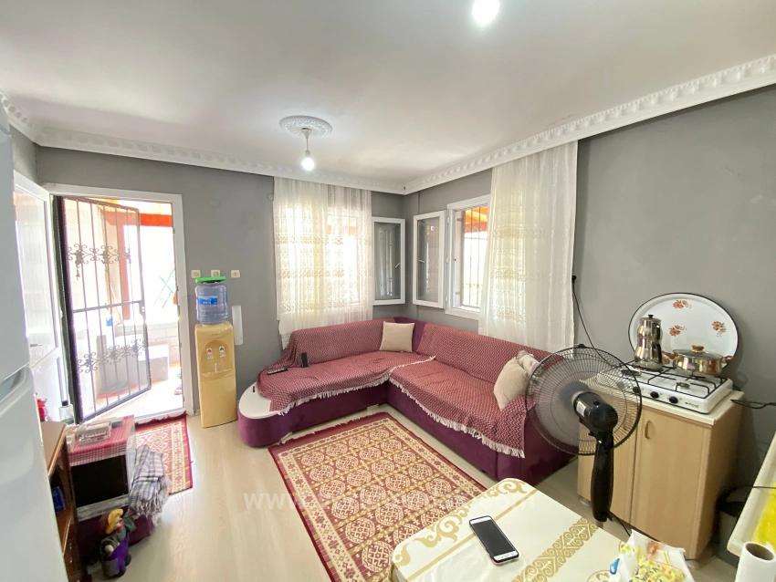 1+1 Ground Floor Apartment For Sale In Seferihisar Mersin Area, 100M From The Sea, With Garden And Renovation Required