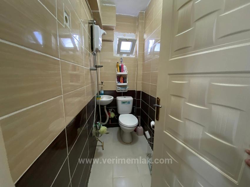 1+1 Ground Floor Apartment For Sale In Seferihisar Mersin Area, 100M From The Sea, With Garden And Renovation Required