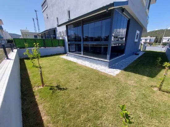 In the Republic Neighbourhood of Seferihisar, 1 km to the sea, a 4+1 wide garden luxurious villa for sale