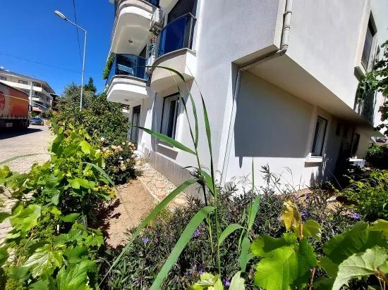 İzmir Seferihisar Ürkmez'de For Sale Garden Ground Floor Apartment 2+1