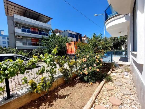 İzmir Seferihisar Ürkmez'de For Sale Garden Ground Floor Apartment 2+1
