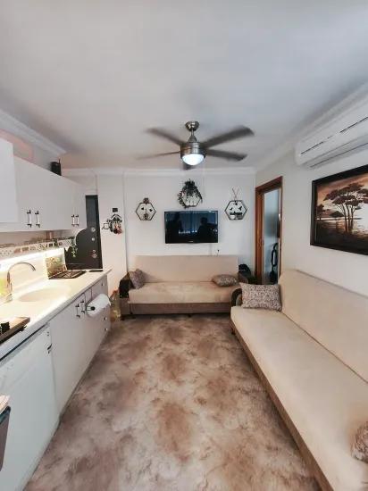 On Gümüldür Beach 1+1 50 m2 furnished at an appropriate price for sale apartment