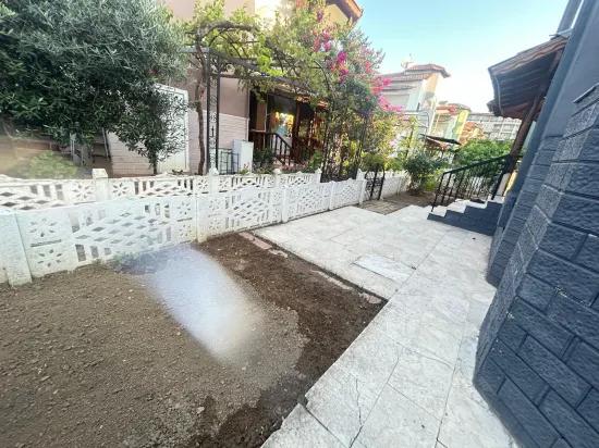 In Gümüldür, a 4+1 villa for sale with a large garden within a 100m site from the sea