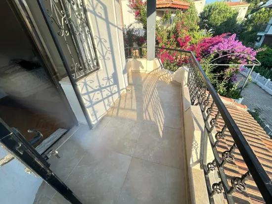 In Gümüldür, a 4+1 villa for sale with a large garden within a 100m site from the sea