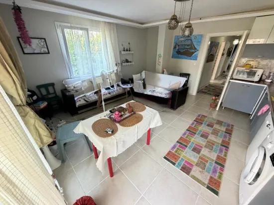 In Seferihisar Bengiler, 350m to the sea, a 2+1 apartment for sale with a wide garden with fruit trees!