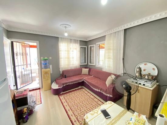 1+1 Ground Floor Apartment For Sale In Seferihisar Mersin Area, 100m From The Sea, With Garden And Renovation Required
