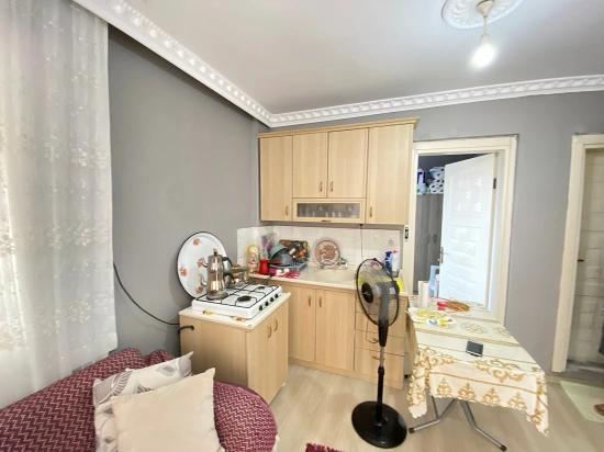 1+1 Ground Floor Apartment For Sale In Seferihisar Mersin Area, 100m From The Sea, With Garden And Renovation Required