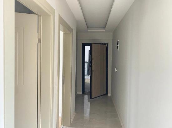 2+1 Ground Floor Apartment For Sale With Elevator In The Market Center Of Gumuldur