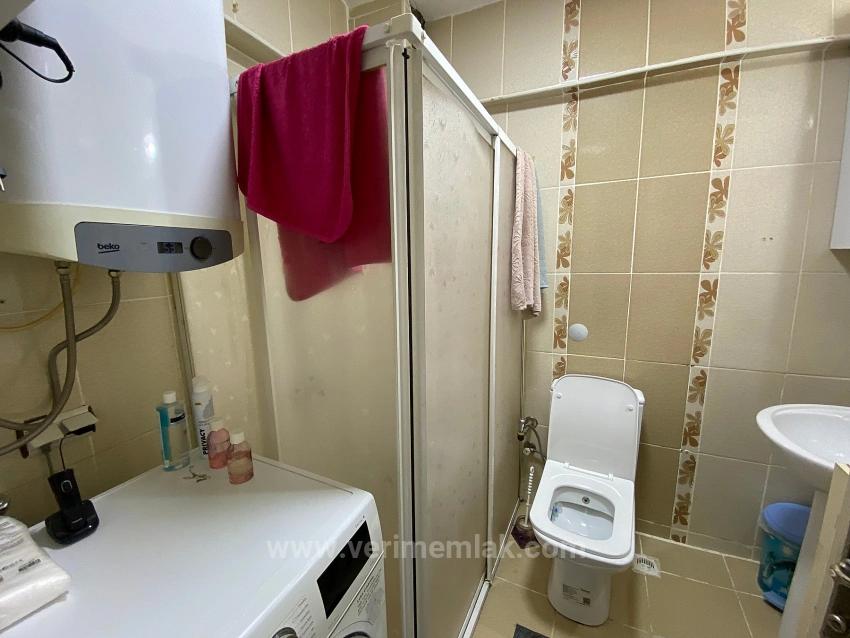 Продается 2+1 Квартира В Районе Сеферихисар Уркмез, Первый Этаж, В 150 М От Моря.