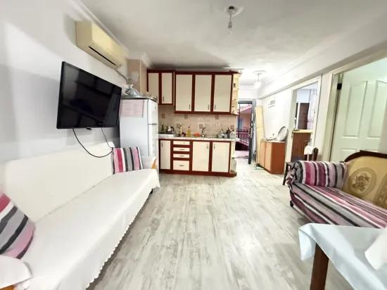 в районе Seferihisar Mersin, 150 м к морю без расходов, просторная квартира 2+1 продаётся