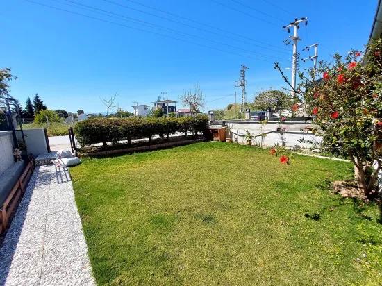 Seferihisar Doğanbey'de bahçeli deniz manzaralı satılık 4+1 villa –