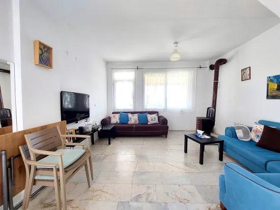 Seferihisar Doğanbey'de bahçeli deniz manzaralı satılık 4+1 villa –
