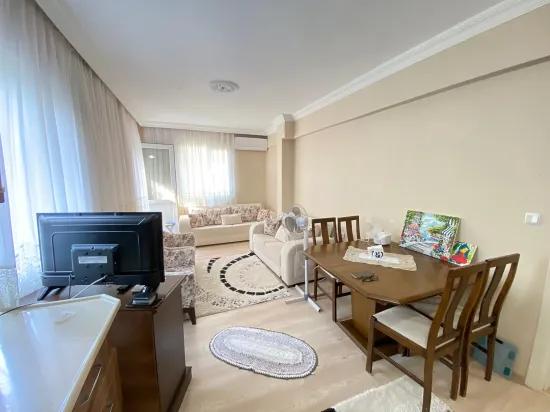 Seferihisar Mersin Alanı'nda denize 400m sıfır eşyalı bahçe katı satılık 2+1 daire