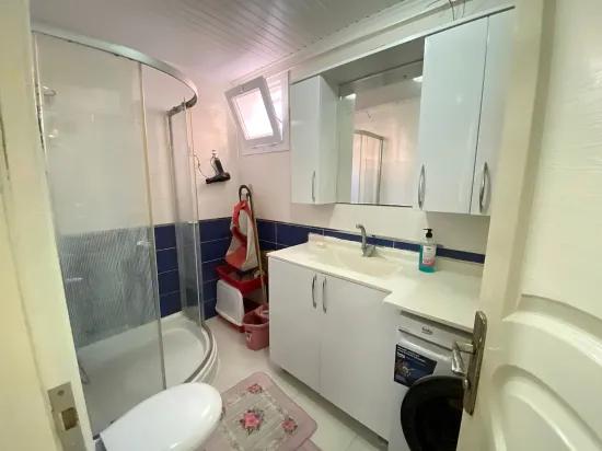 Seferihisar Mersin Alanı'nda denize 400m sıfır eşyalı bahçe katı satılık 2+1 daire